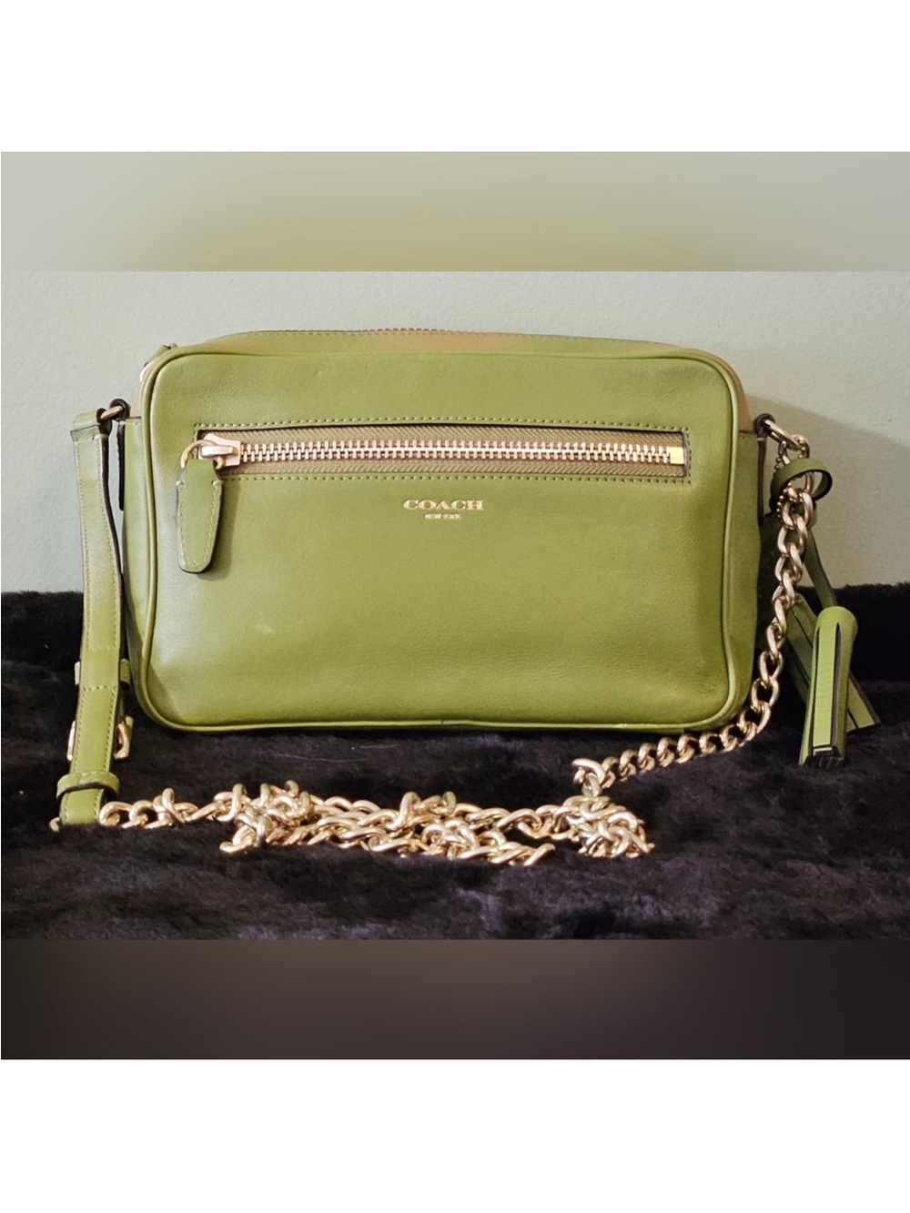 Coach Legacy leather crossbody bag in a vibrant lime green color